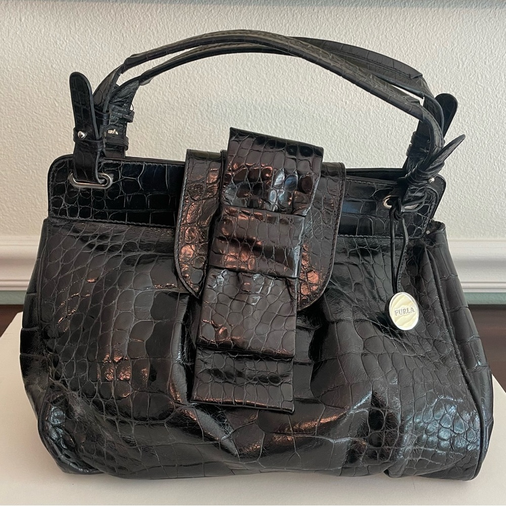 Black leather Furla purse with embossed faux alligator texture.